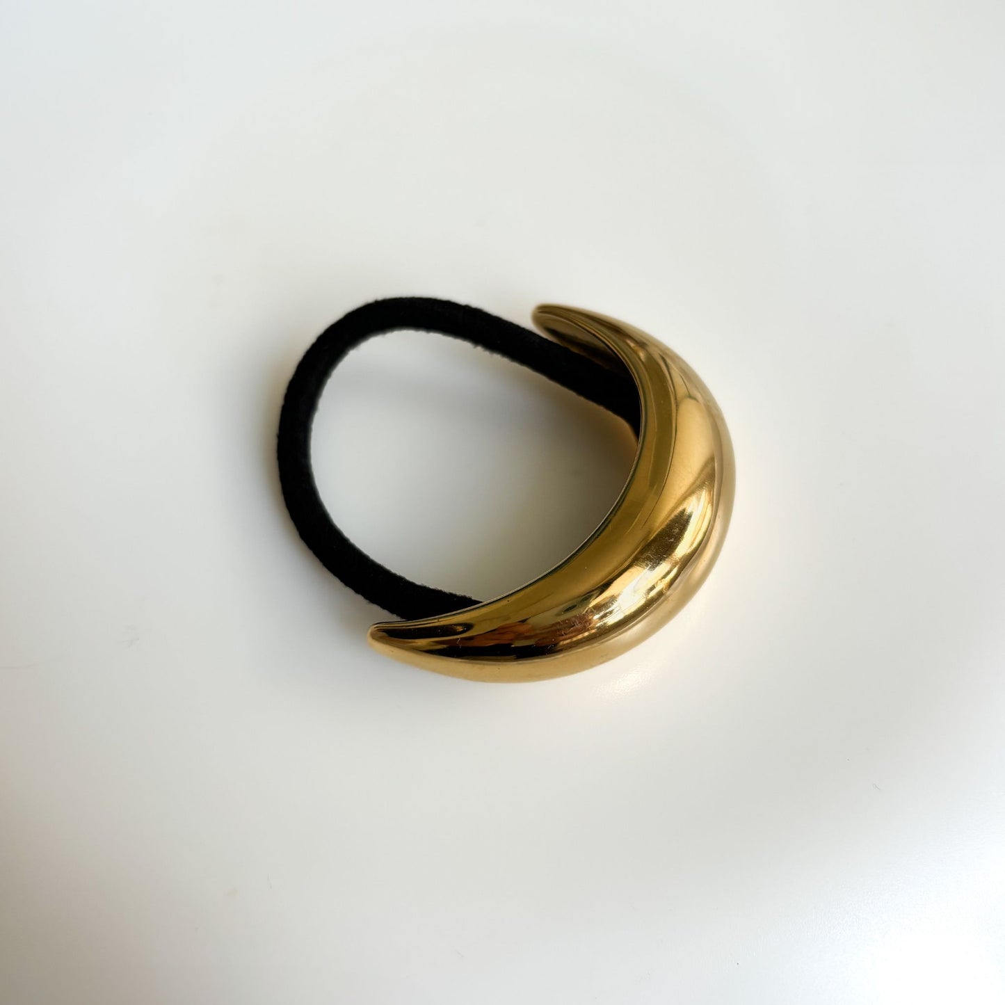Crescent hair tie